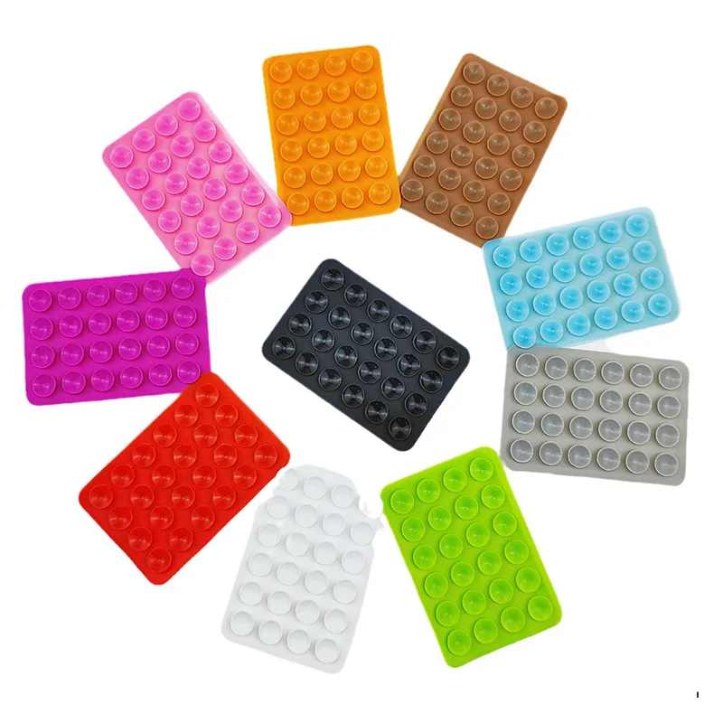 Colourful silicone suction phone mount plates fanned out